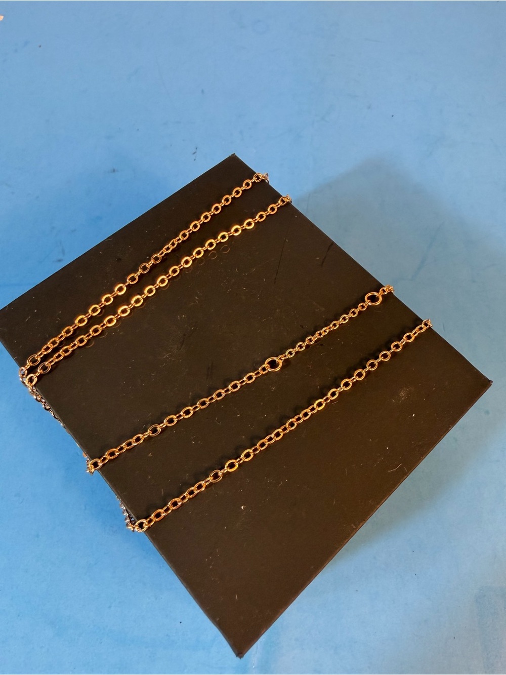 An elegant chain necklace—a minimalist piece of women's jewelry.